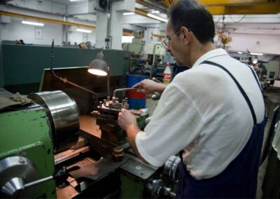 Expert machinist fabricates diesel engine parts machining on the lathe